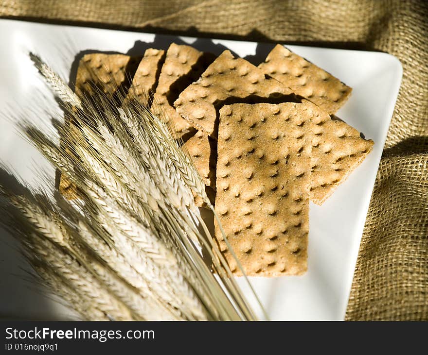 Biscuit bread with corn on a white plate. Biscuit bread with corn on a white plate