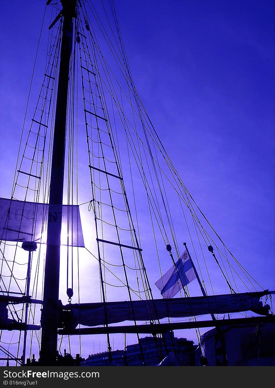 Mast of the old ship and the Finnish flag. Mast of the old ship and the Finnish flag