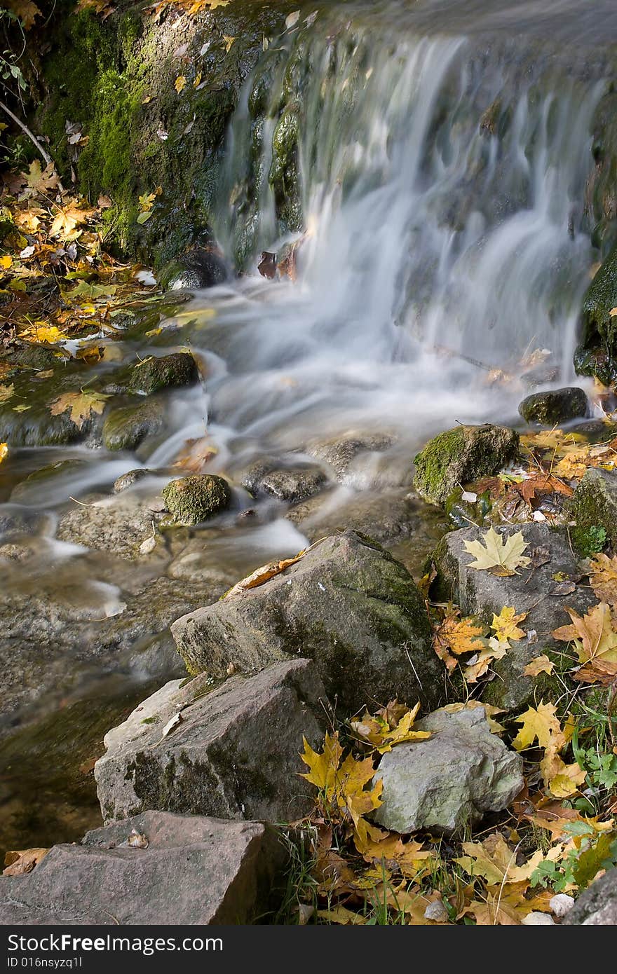 Autumn waterfall in ukrainian national park.