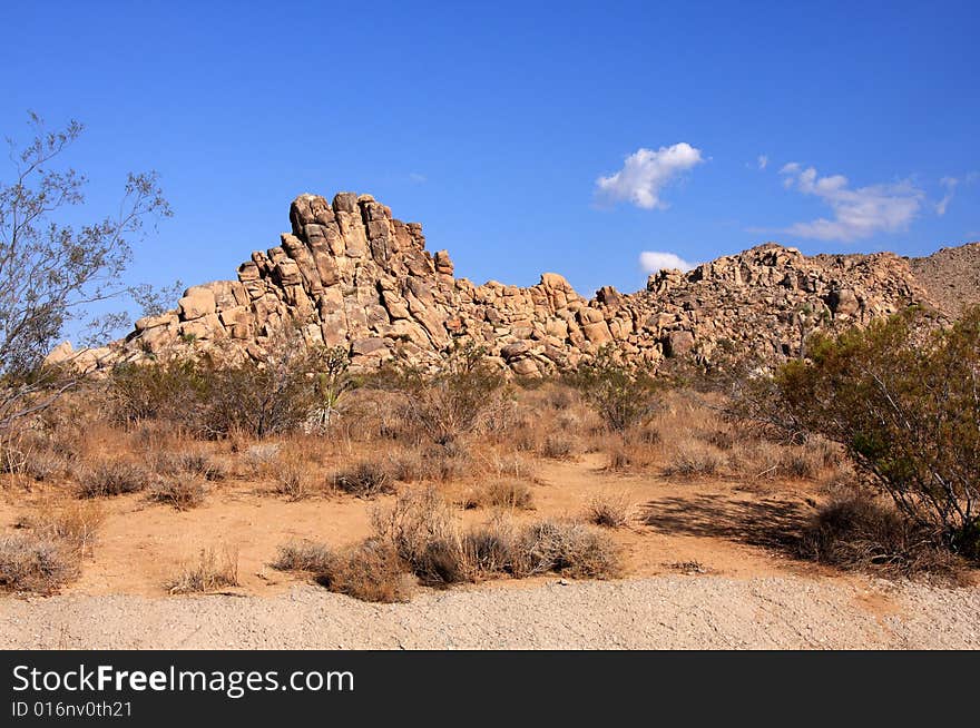 Red rock formation in the desert under a vivid blue sky