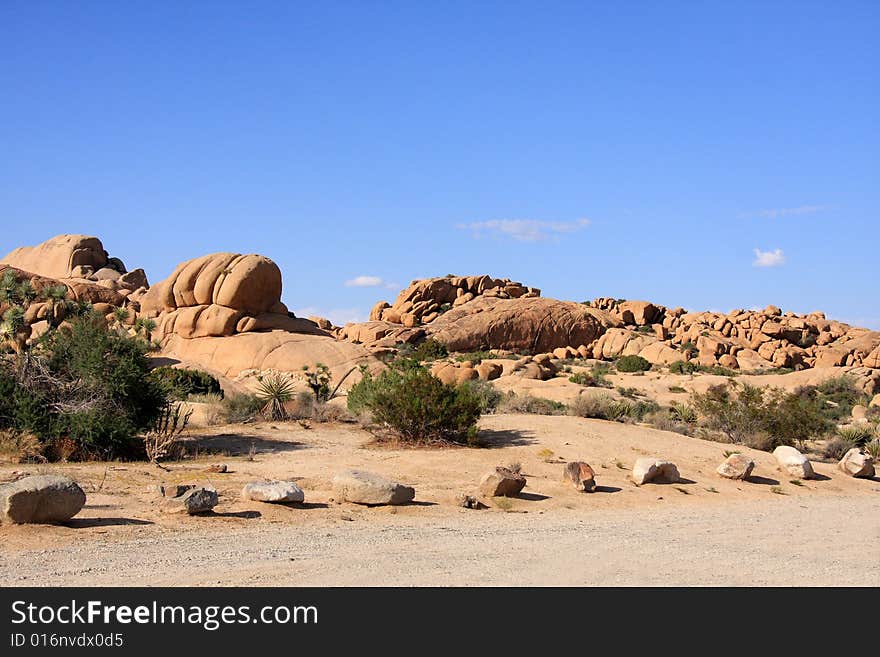 Red rock formation in the desert under a vivid blue sky