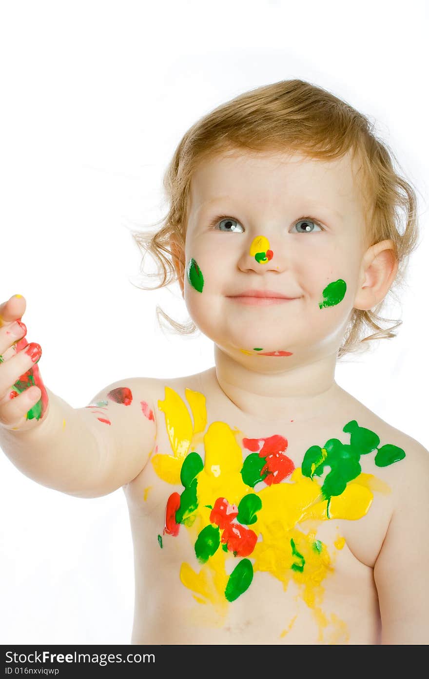 Little artist with many of paint spots on her body and face