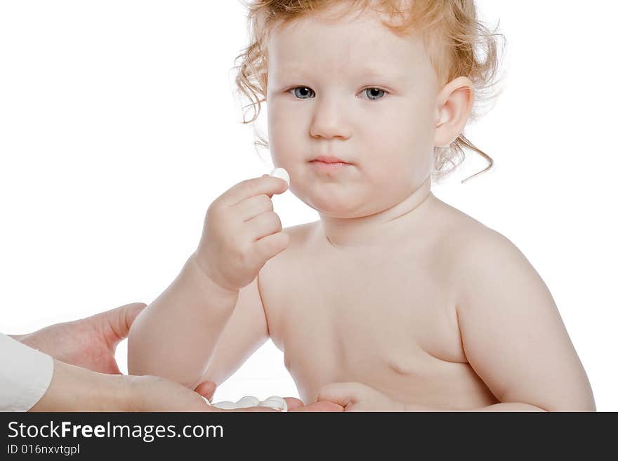 Little child and doctor gives her a white tablet