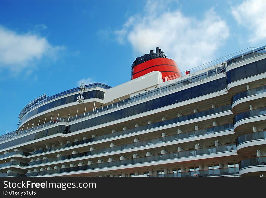 Cruise ship docked in port.