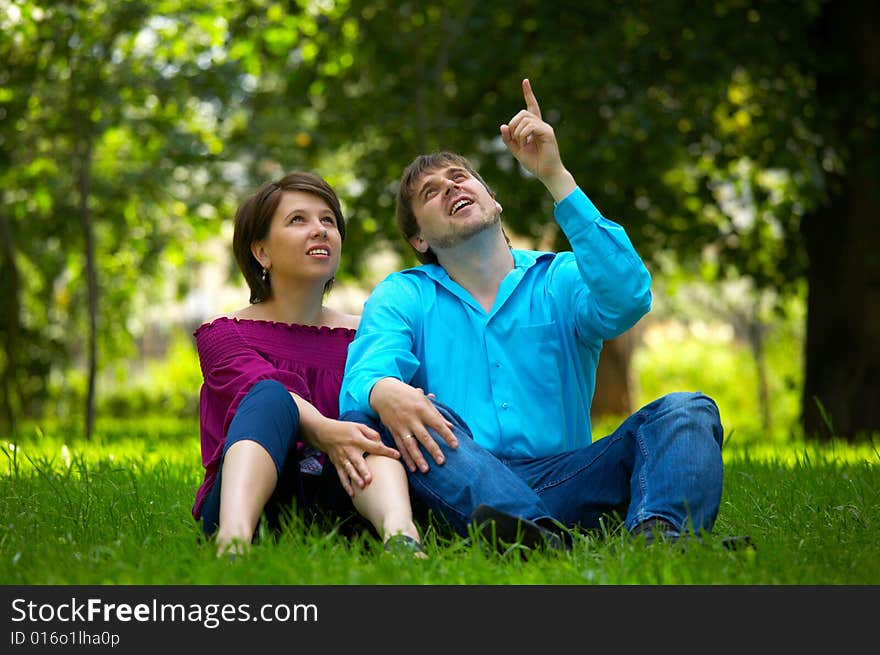 The happy married couple has a rest in park. The happy married couple has a rest in park