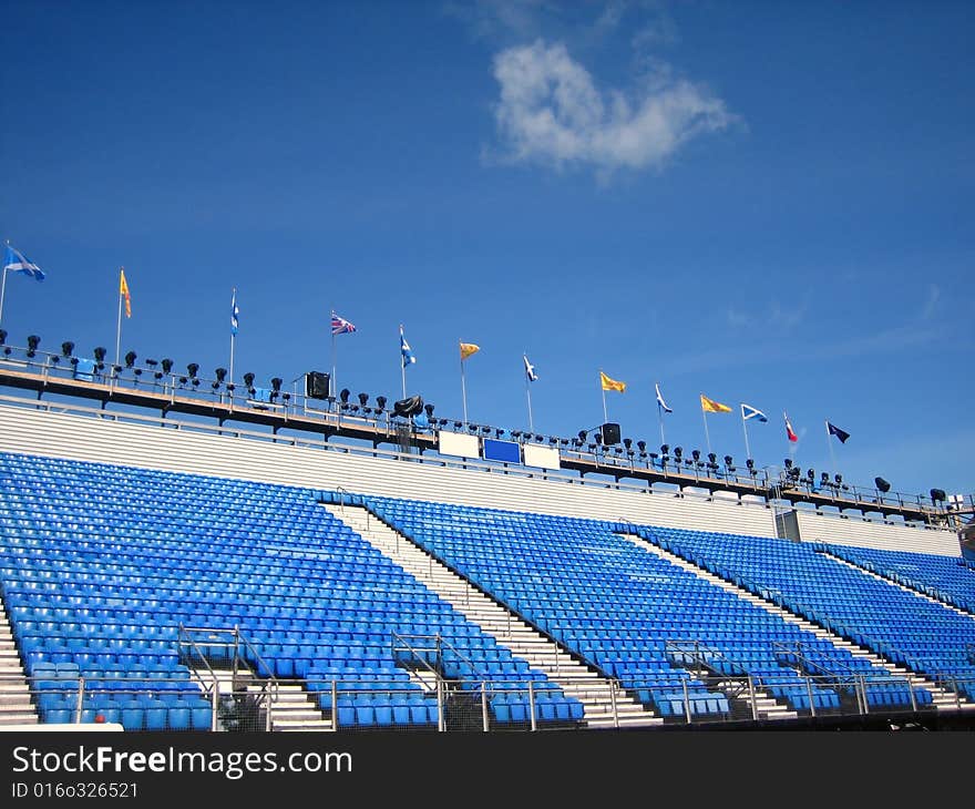 Blue stadium seats and flags