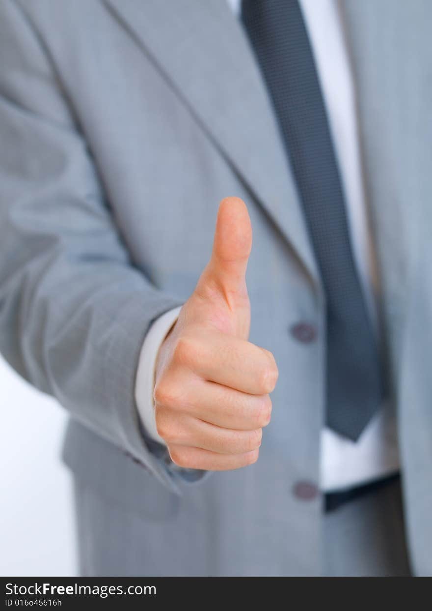 Portrait of handsome businessman showing thumb up hand sign