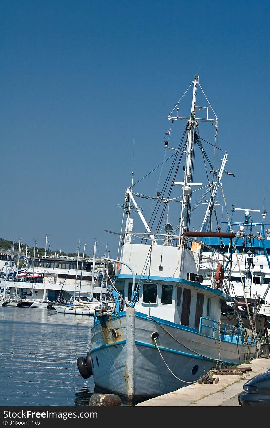 Ship anchored near pier