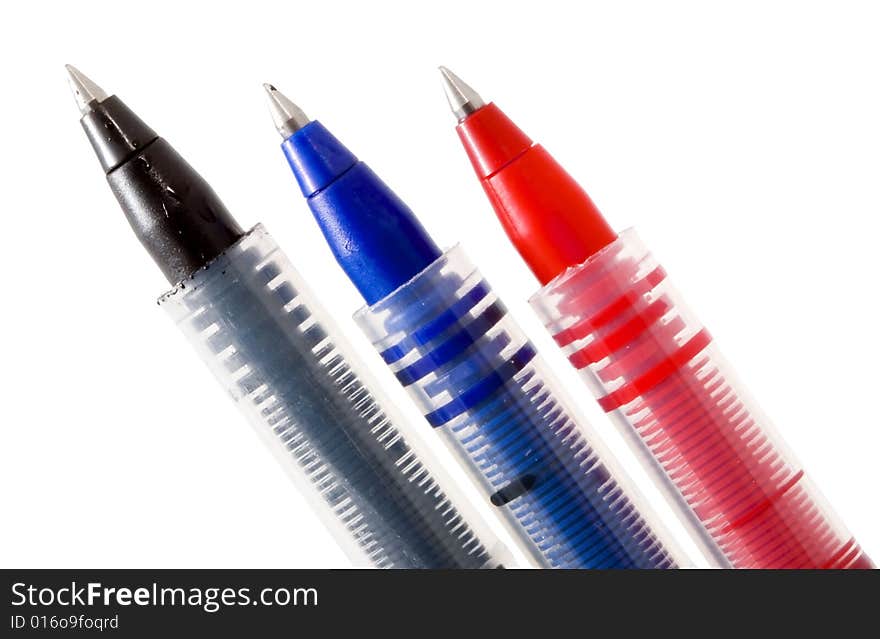 Red, blue and black pens on the white background. Red, blue and black pens on the white background