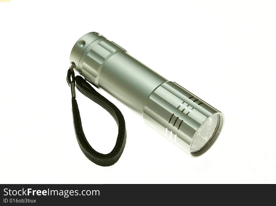 An electric flashlight on a white background. An electric flashlight on a white background