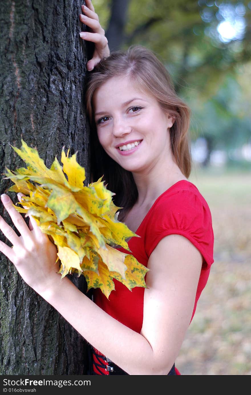 Beauty woman with yellow leaves