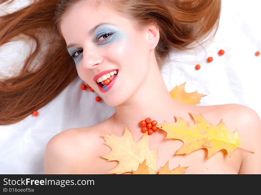 Portrait of a young woman with ashberry in her lips. Portrait of a young woman with ashberry in her lips