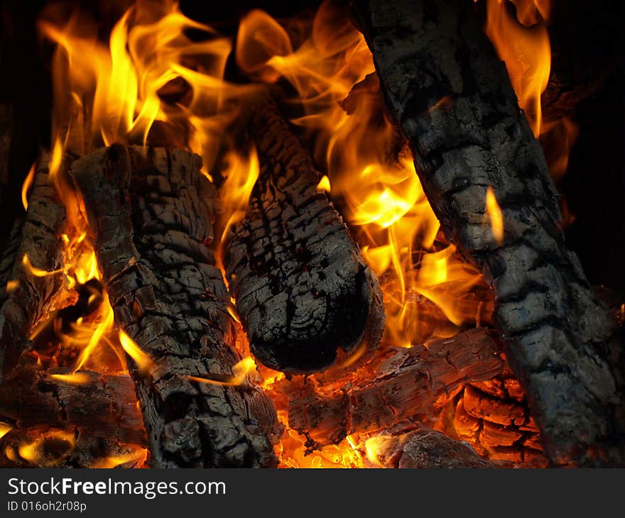 Logs burns in hot fire