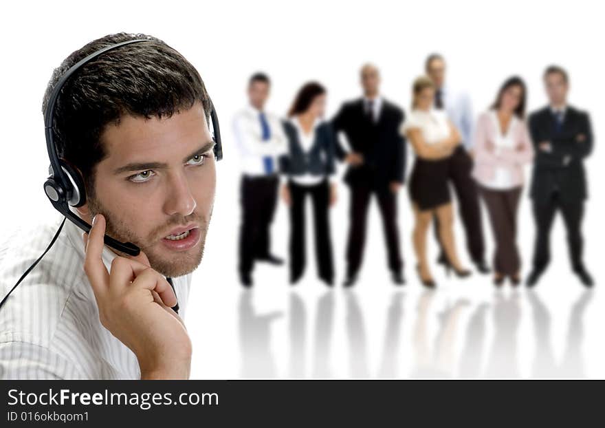 Businessman talking on headphone with businesspeople