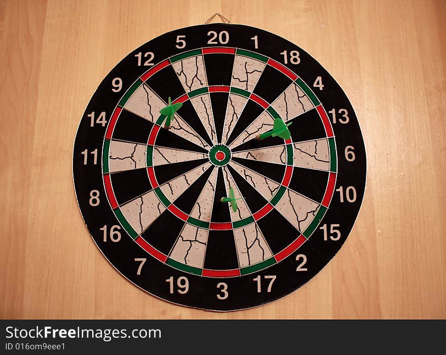 Three darts in the dartboard