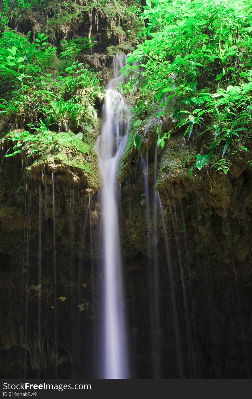 The water flowed down the cliff