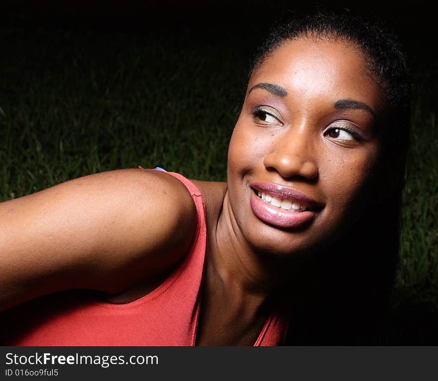 Young female smiling over her shoulder. Young female smiling over her shoulder