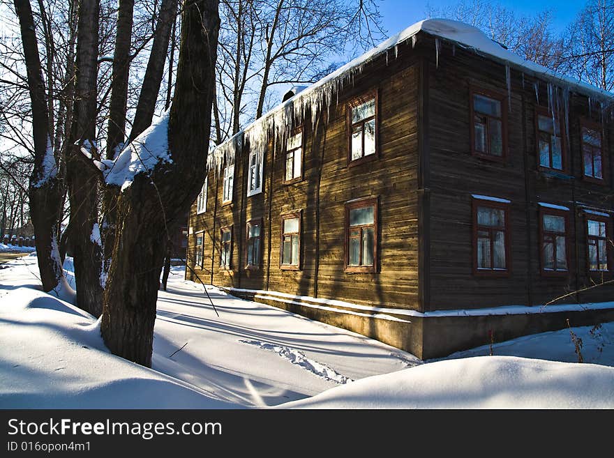 Wooden house in solar winter day. Wooden house in solar winter day