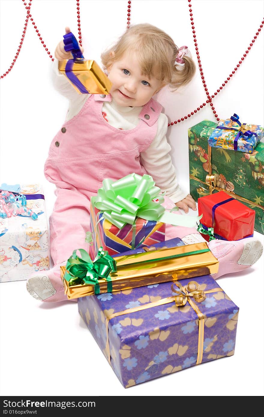 Happy infant with gifts in the decorated christmas box