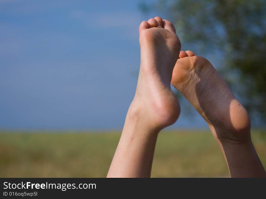 Recreation in nature. Heels against the backdrop of the sky