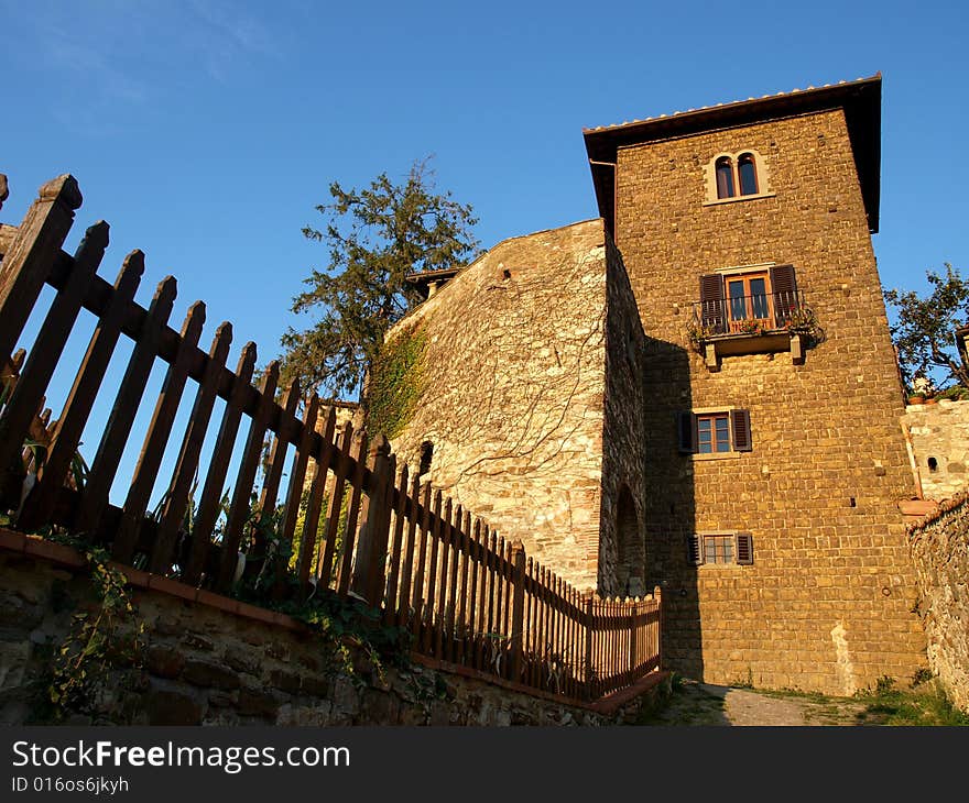 A wonderful glimpse of a fench and an old house in Florence countryside. A wonderful glimpse of a fench and an old house in Florence countryside