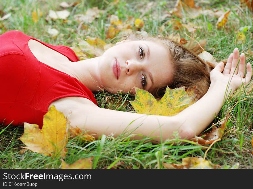 Young Woman And Maple Leaf