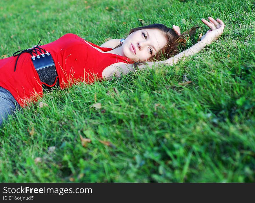 Young woman and green grass