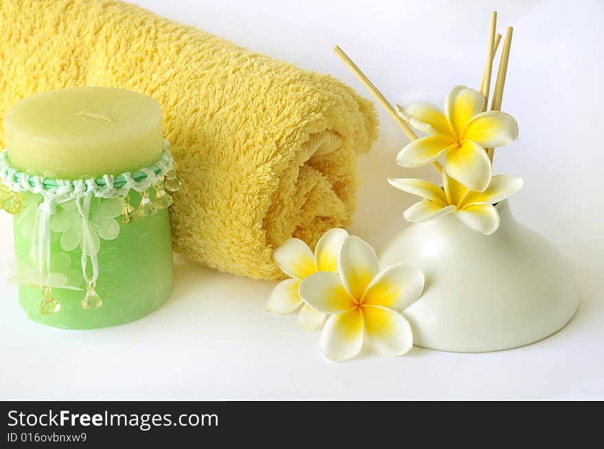 Candle, towel and scent diffuser on white background. Candle, towel and scent diffuser on white background