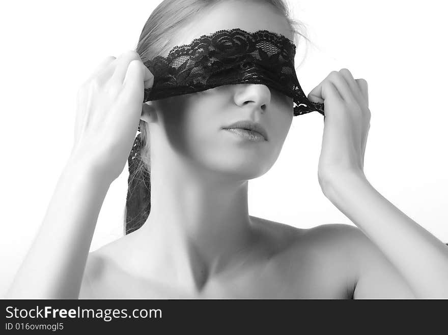 Portrait of a beautiful woman with black lace on her eyes. Portrait of a beautiful woman with black lace on her eyes