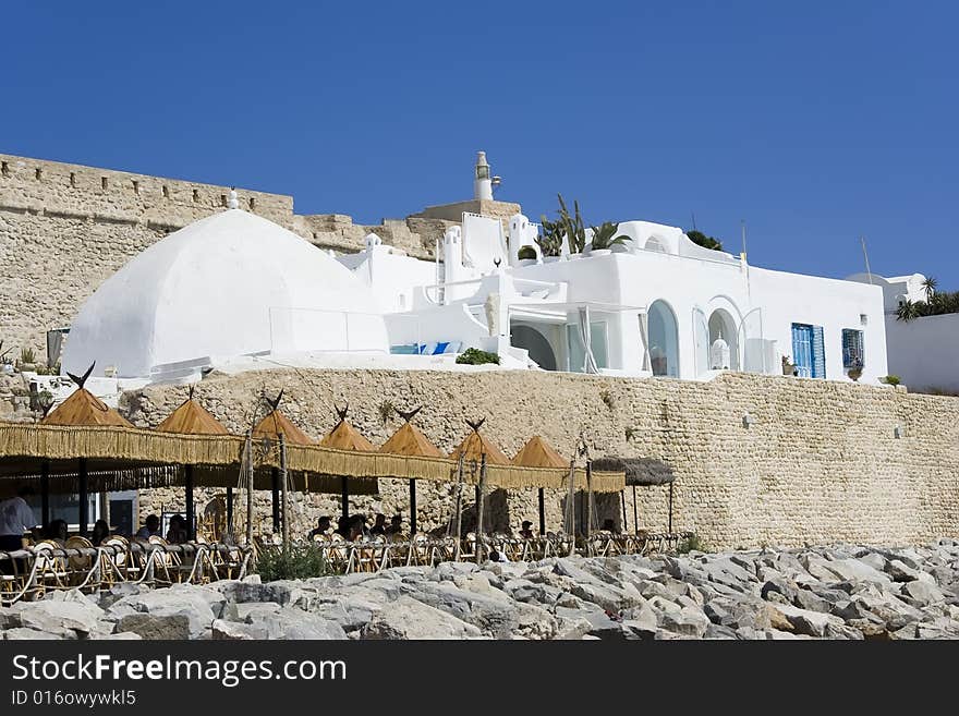 White arabic medina over old wall. White arabic medina over old wall