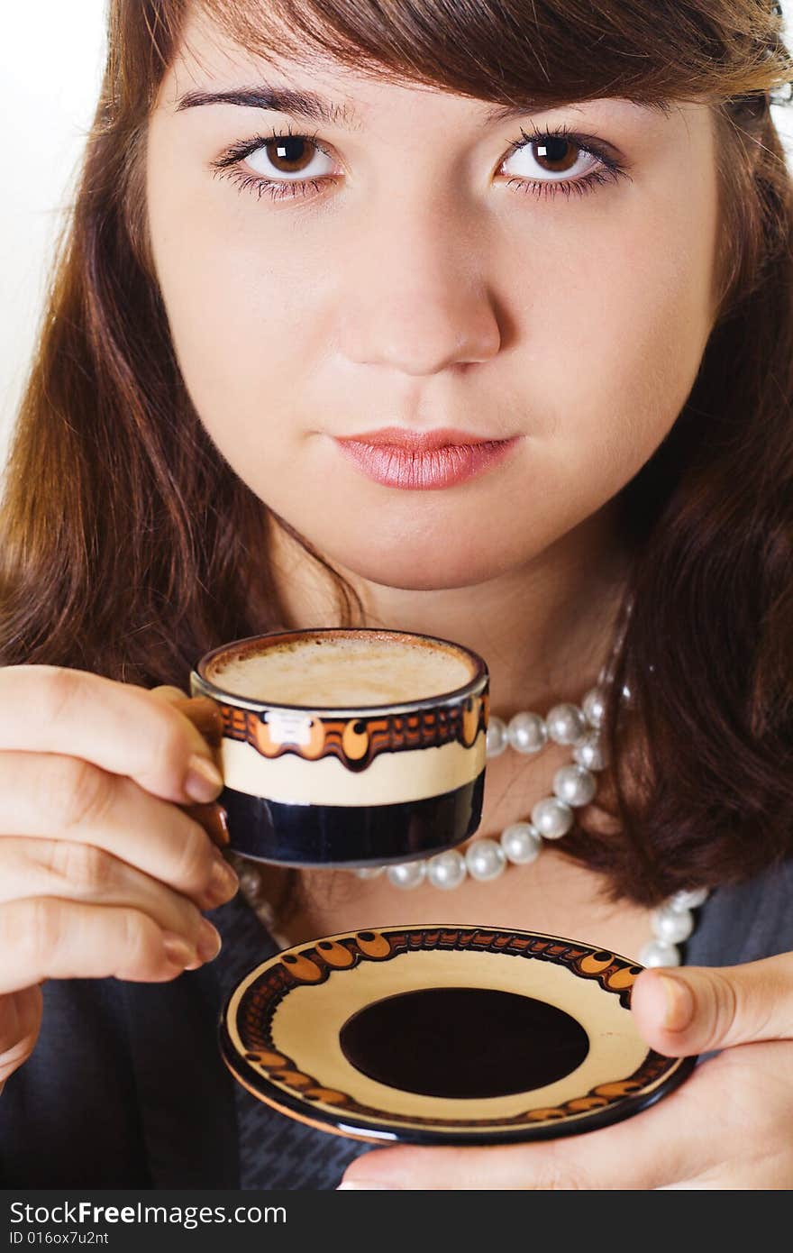 Woman is holding a coffee cup