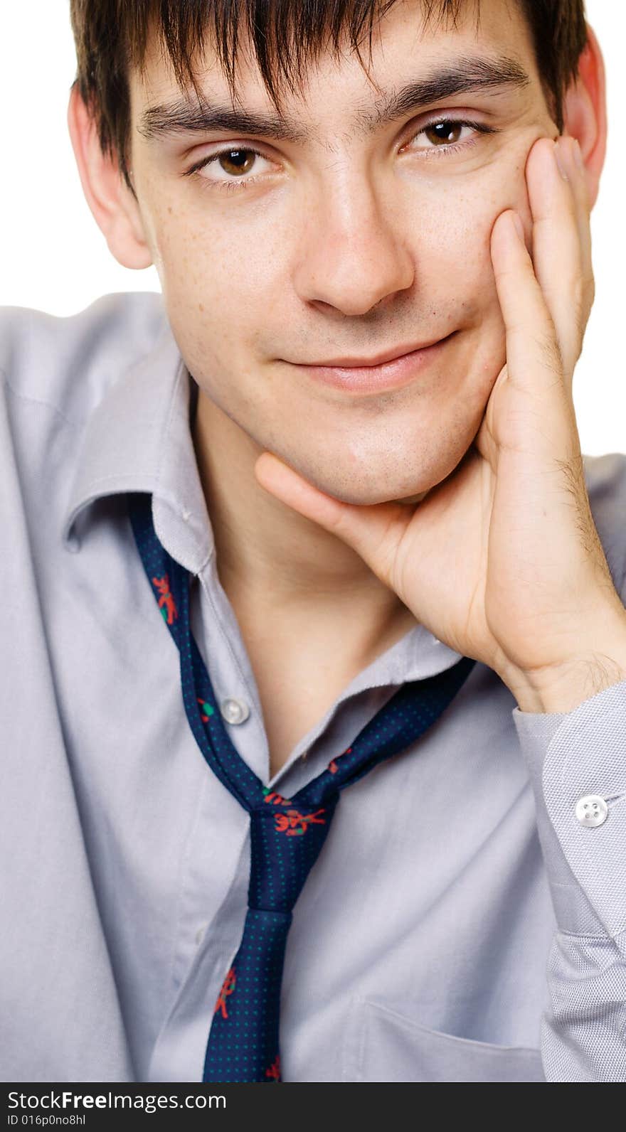 Young man looking calmly on white background