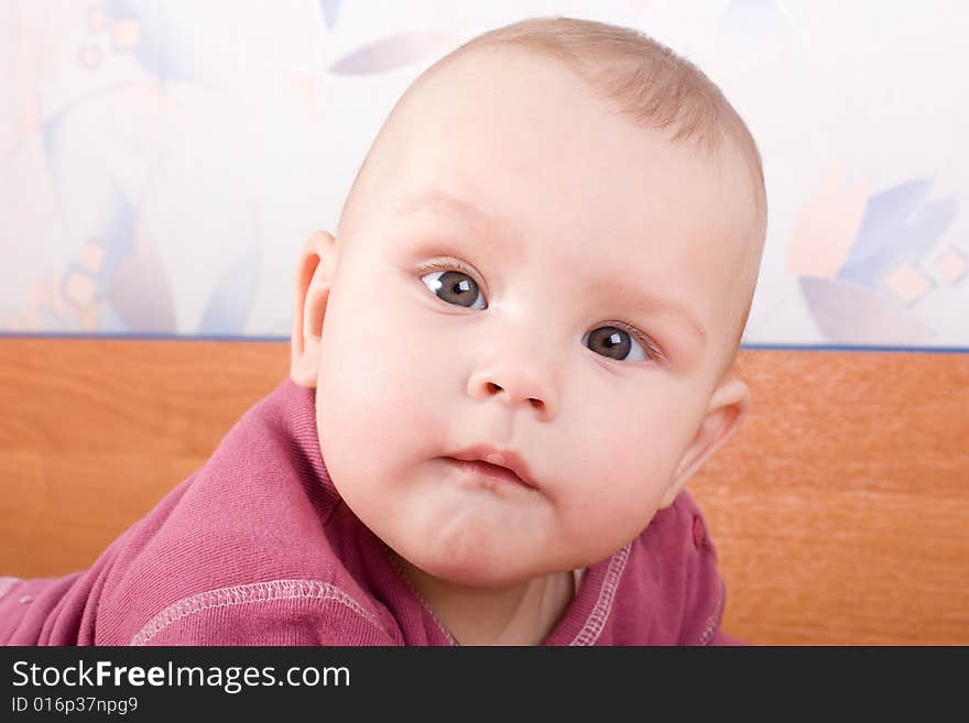 Attentive look of baby on photographer