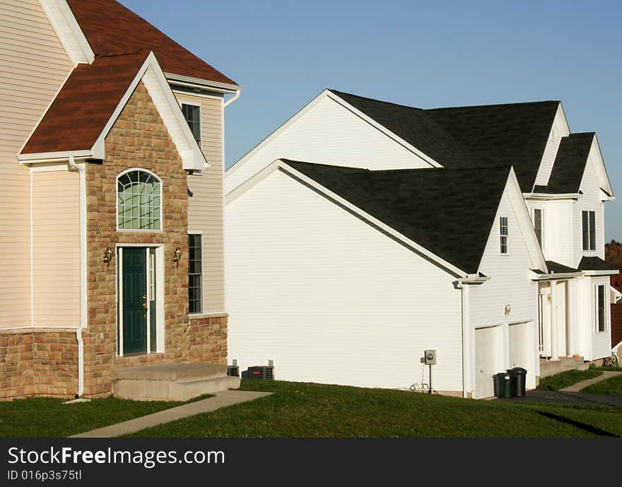 Cookie-cutter homes on a quiet street. Cookie-cutter homes on a quiet street