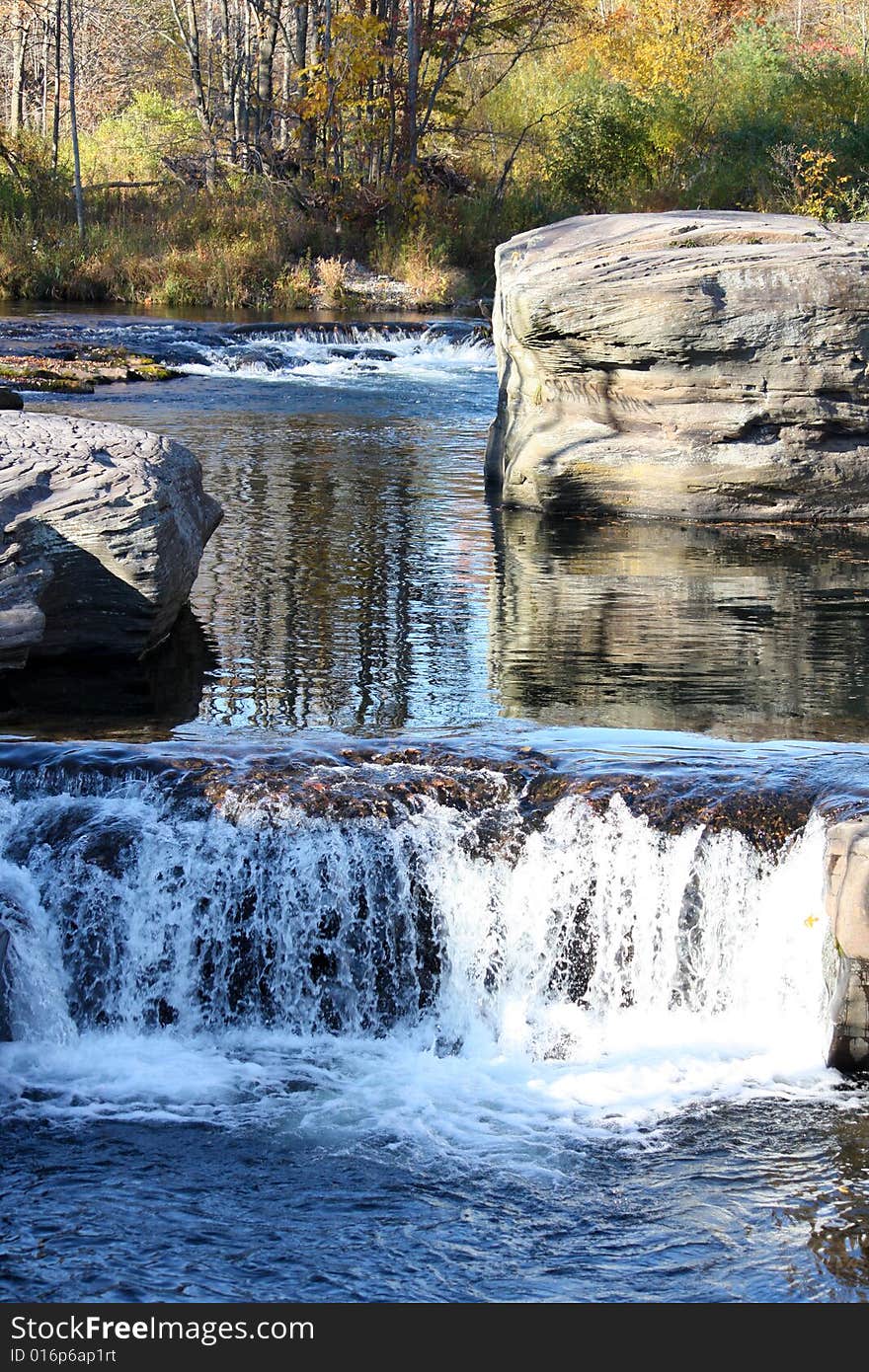 Clean mountain water rushing down the river in October. Clean mountain water rushing down the river in October