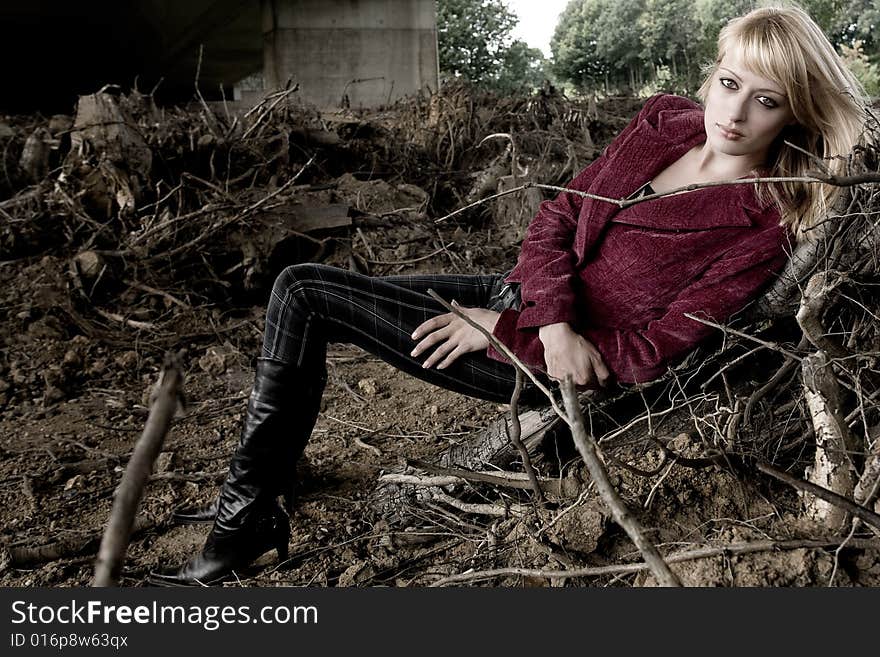 Fashion shoot of a beautiful girl under a bridge. Fashion shoot of a beautiful girl under a bridge