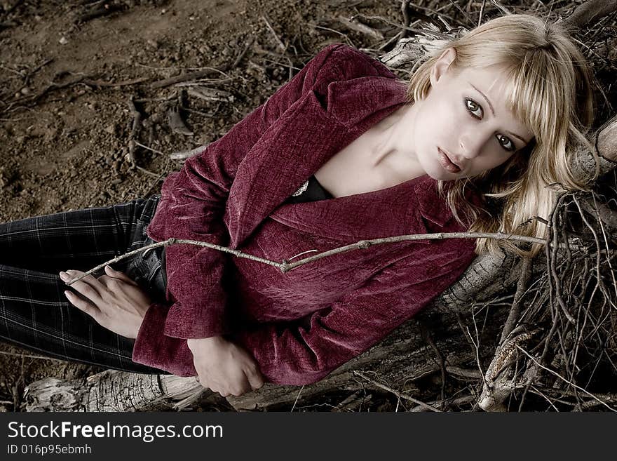 Fashion shoot of a beautiful girl in dead wood. Fashion shoot of a beautiful girl in dead wood