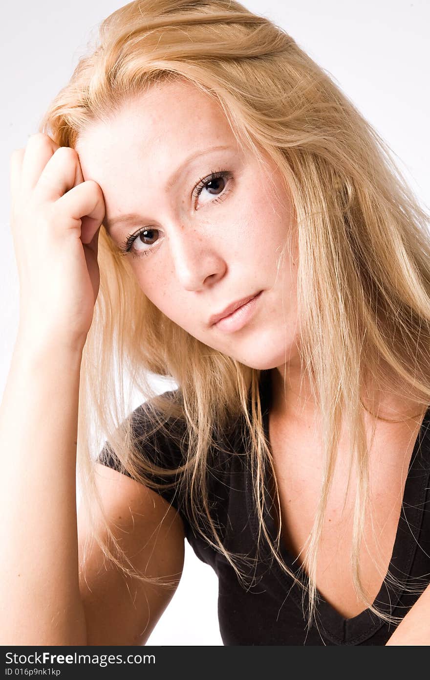 Portrait of a Young blond girl made in the studio