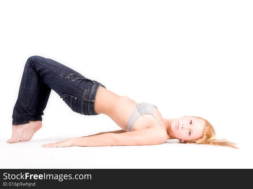 Young blond girl in lingerie stretching