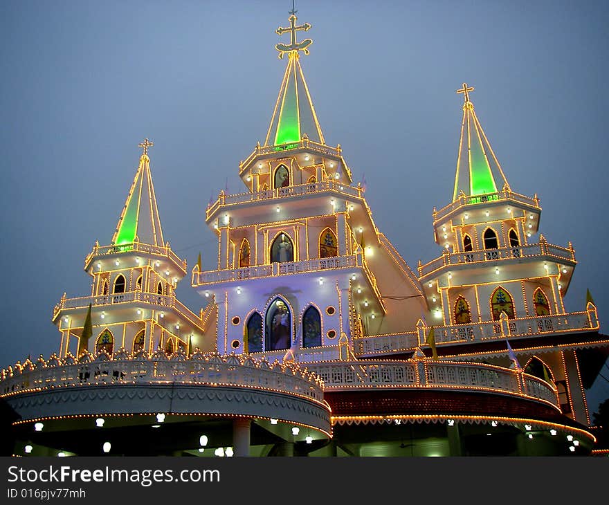 Illuminated church building during the opening celebration and blessing.