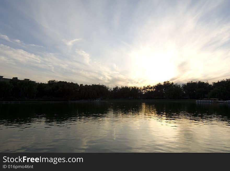 The setting sun in park.