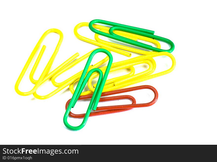 Paper clips in different figures on a white background