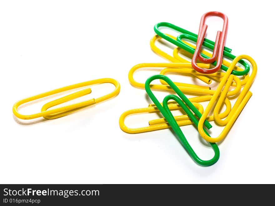 Paper clips in different figures on a white background