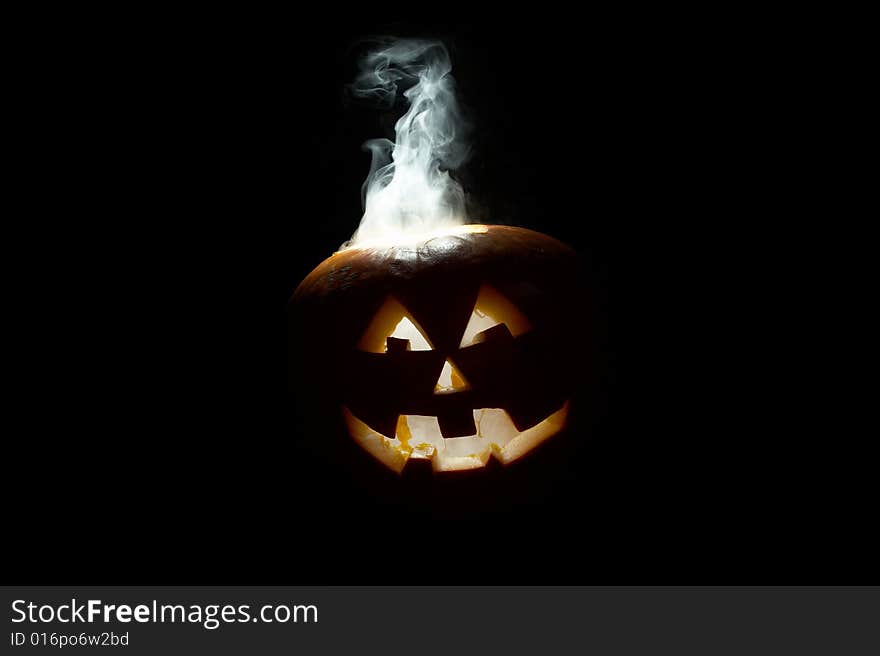 Halloween pumpkin with smoking crown of the head. Halloween pumpkin with smoking crown of the head