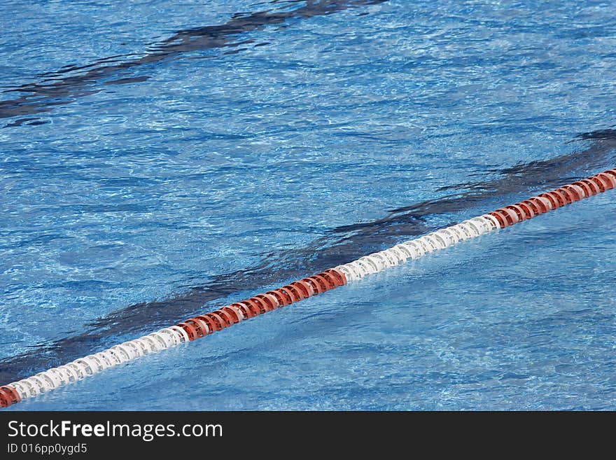 Bright blue water in swimming pool