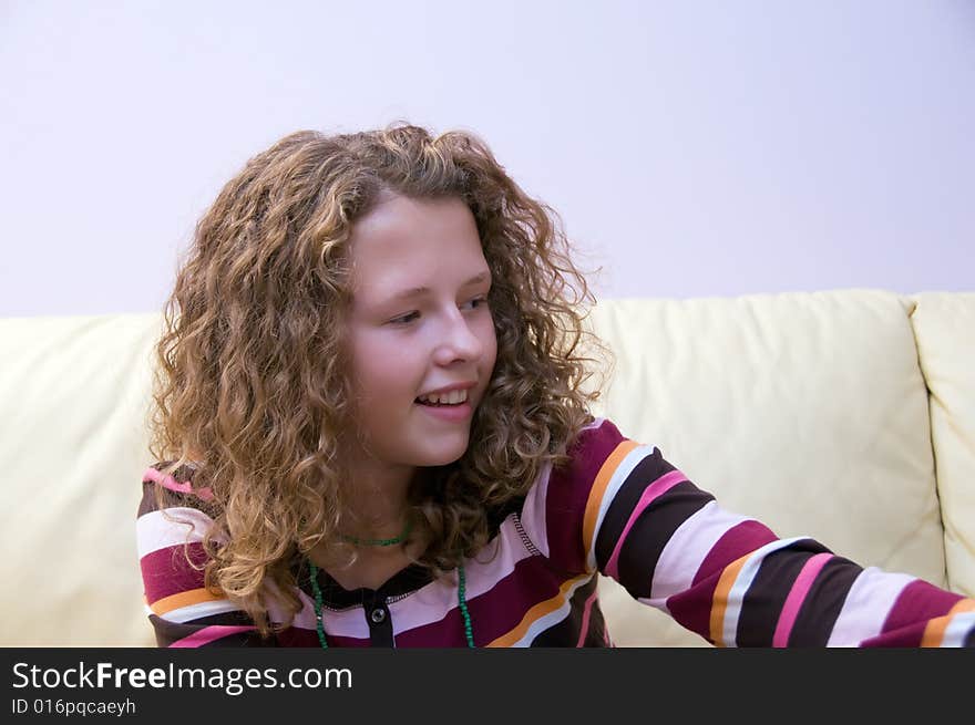 Pretty girl with curled hair smiling. Pretty girl with curled hair smiling