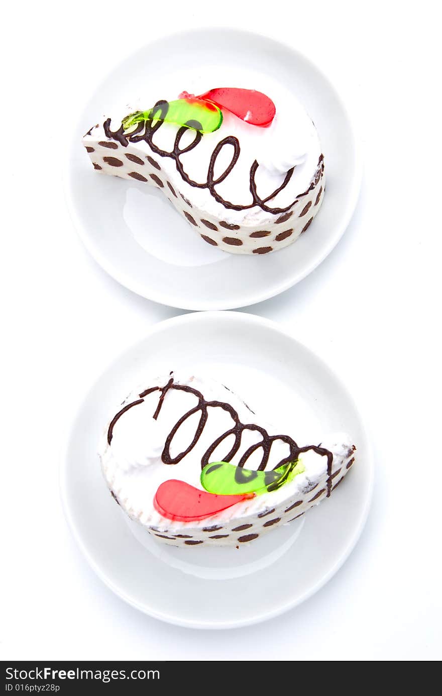 Two tasty cakes on white plates