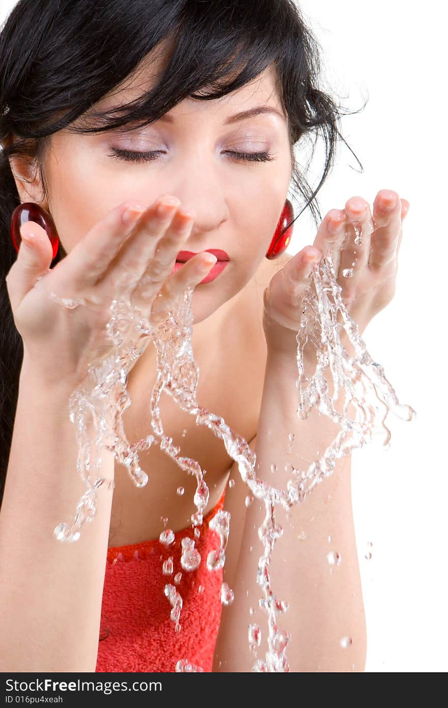 Pretty woman refreshing the face isolated over white background