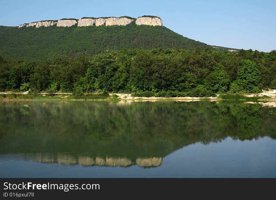 Beautiful lake with mountains reflected in water. Beautiful lake with mountains reflected in water