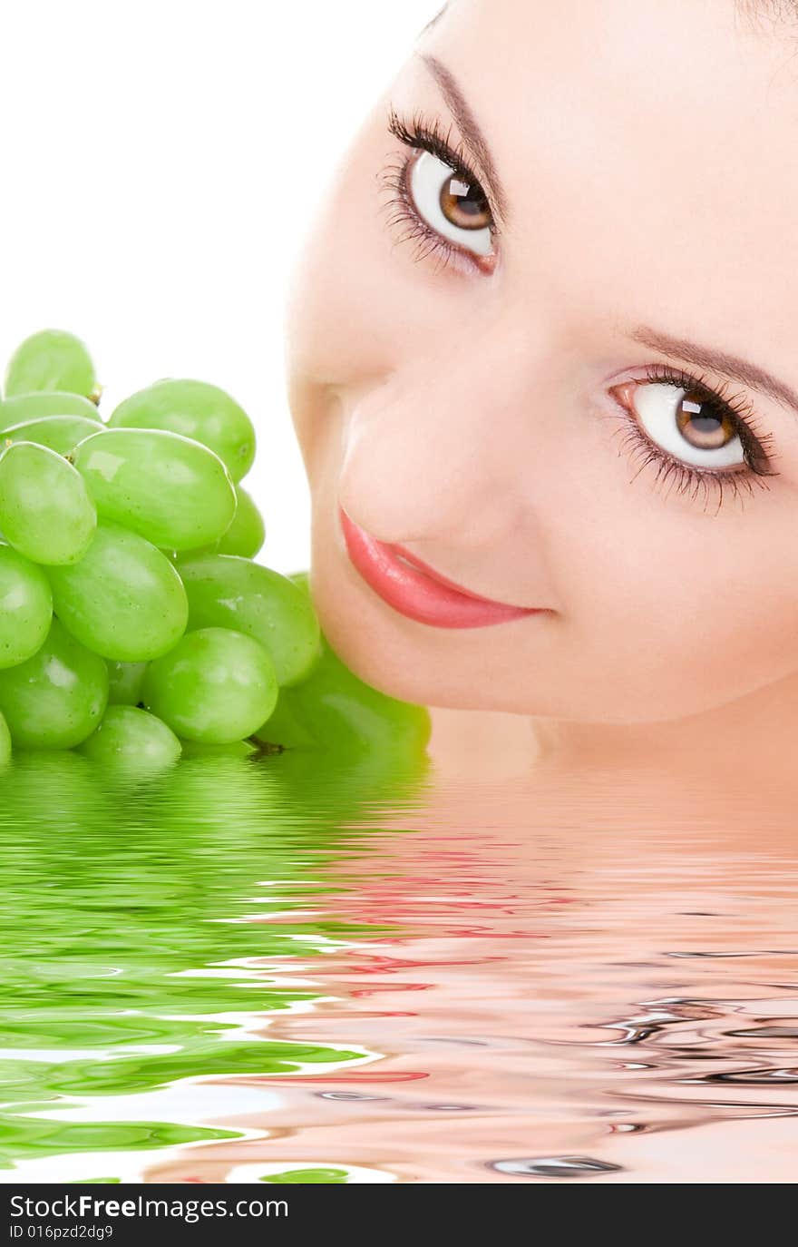 Pretty woman with green grape